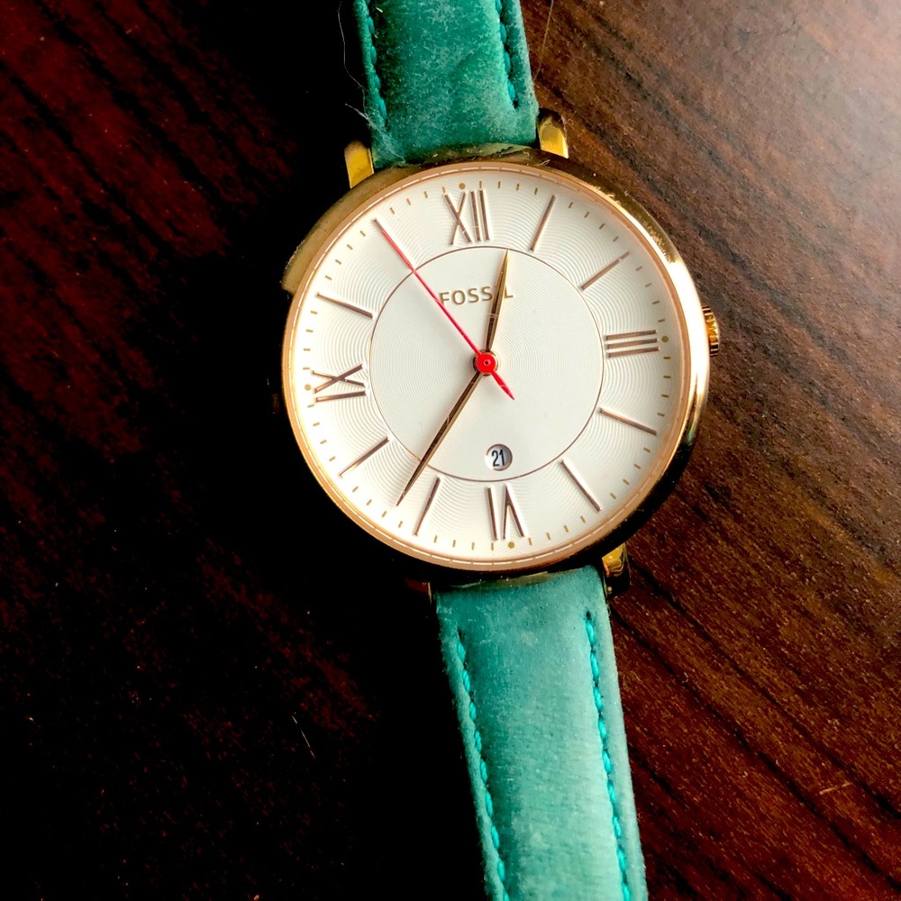 Fossil Watch with teal wristband. Batteries are new.